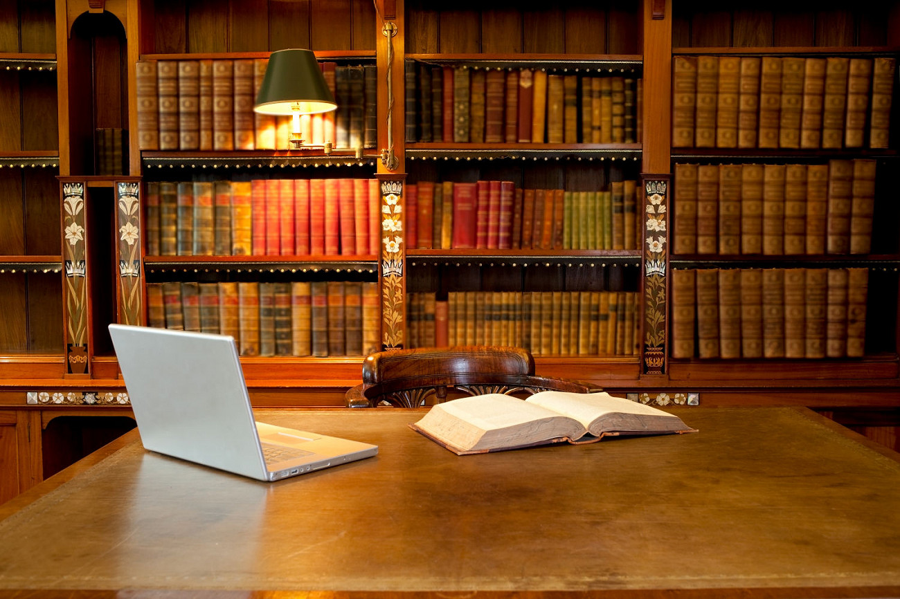 Laptop and book on a desk